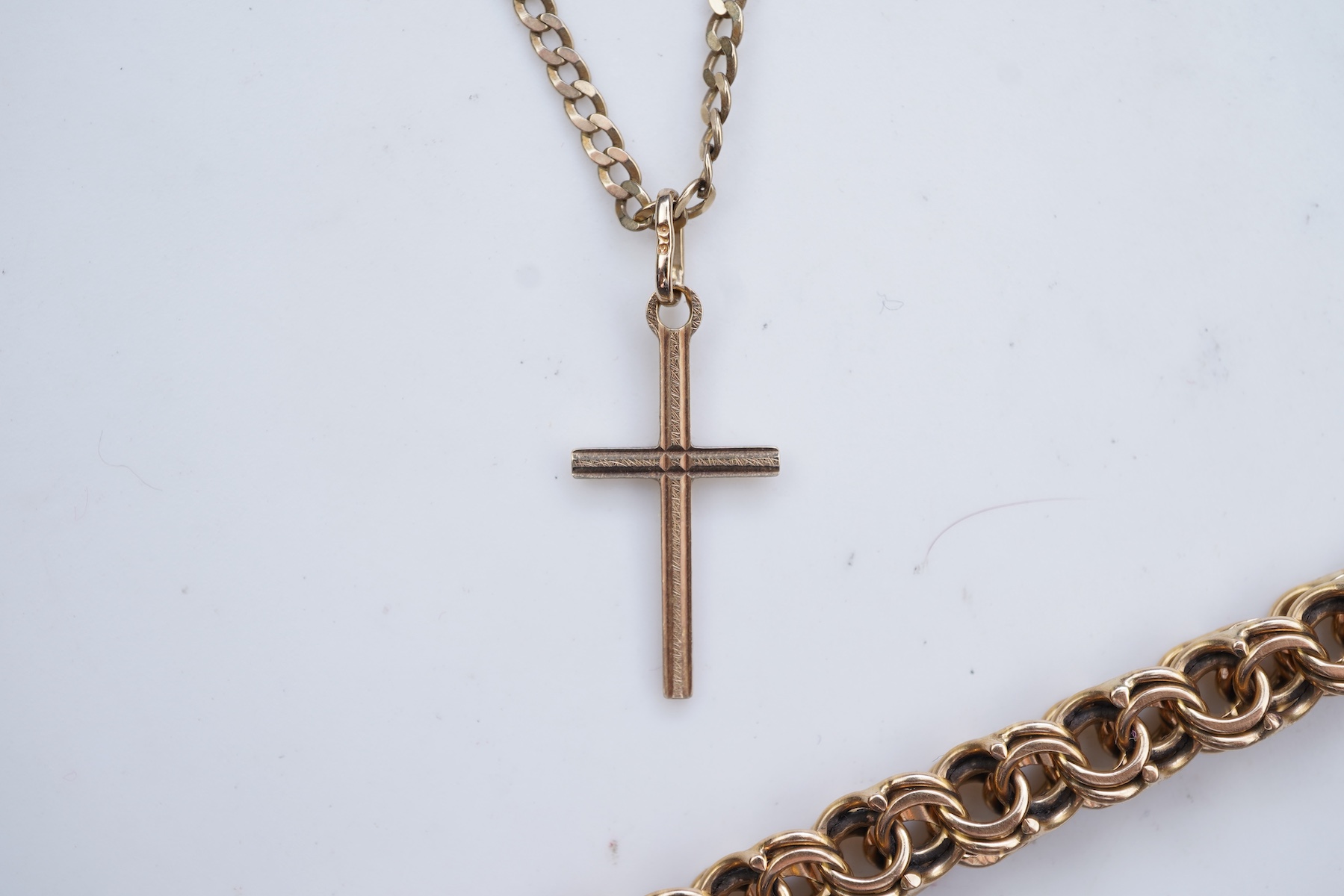 Two gold bracelets and a gold necklace